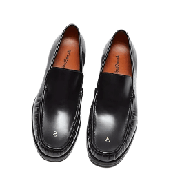 A pair of loafers on a plain background